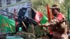 Private security guards secure the venue of a mourning procession ahead of Ashura, in Herat, western Afghanistan, on September 19.