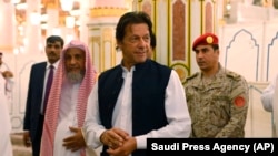 Pakistani Prime Minister Imran Khan visits the Prophet's Mosque in Medina, Saudi Arabia, on September 18.