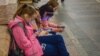 Russia -- Passengers at Arbatskaya Station