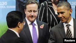 Samitu G20, američki predsednik Barak Obama (desno), sa svojim kineskim kolegom Hu Đintao (levo) i britanski premijer Dejvid Kameron, Seul, 12. novembar 2010.