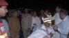 Officers and rescue workers move Pakistan's Interior Minister Ahsan Iqbal on a stretcher, after he was shot during a rally in Narowal and transported for medical attention to Lahore on May 6.