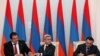 Armenia - President Serzh Sarkisian (C), Prosperous Armenia Party leader Gagik Tsarukian (L) and Oriants Yerkir Party leader Artur Baghdasarian sign a joint declaration in Yerevan, 17Feb2011.