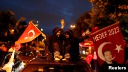 Supporters of AK Party celebrate outside the party's headquarters in Istanbul, Turkey on June 24.