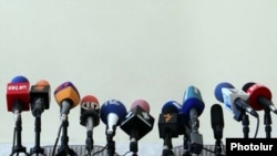 Armenia - TV and radio microphones set for a news conference in Yerevan.