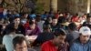 Migrants eat in a dorm in Bihac, Bosnia, on August 20.