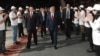 Armenia - President Serzh Sarkisian (R) and Orinats Yerkir Party leader Artur Baghdasarian are greeted by party activists at an event in Yerevan, 20Mar2012.