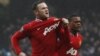 Wayne Rooney (st.) după un gol înscris într-un match cu Machester City