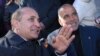 Armenia -- Parliament speaker Hovik Abrahamian (L) urges opposition leader Raffi Hovannisian to end his hunger strike, 25Mar2011.