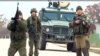 Imagini ale televiziunii ucrainene ATR cu militari ruși care trag focuri de armă în aer, pentru a-i preveni pe militarii ucraineni să se apropie la baza aeriană Belbek, din apropiere de Sevastopol, 4 martie 2014.