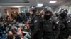 Протестиращите в сградата на държавната телевизия преди да бъдат изкарани от полицията.