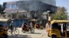 Damaged shops are seen after fighting between the Taliban and Afghan security forces in Kunduz city on August 8.