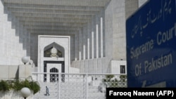 PAKISTAN -- A Pakistani man walks by the Supreme Court building in Islamabad, September 15, 2017